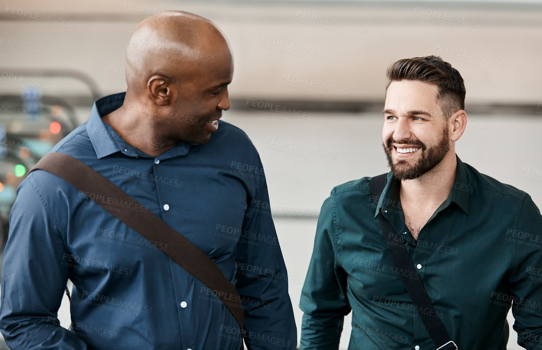Buy stock photo Cropped shot of two businessmen talking while standing in their office