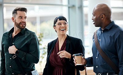 Buy stock photo Cropped shot of three business colleagues talking while walking through their office