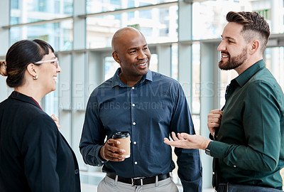 Buy stock photo Cropped shot of three business colleagues talking while standing in their office