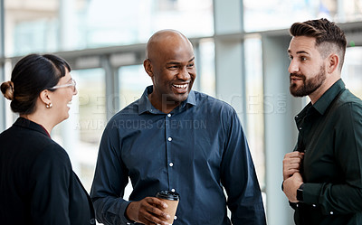 Buy stock photo Cropped shot of three business colleagues talking while standing in their office