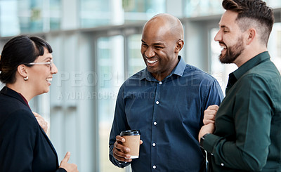 Buy stock photo Cropped shot of three business colleagues talking while standing in their office