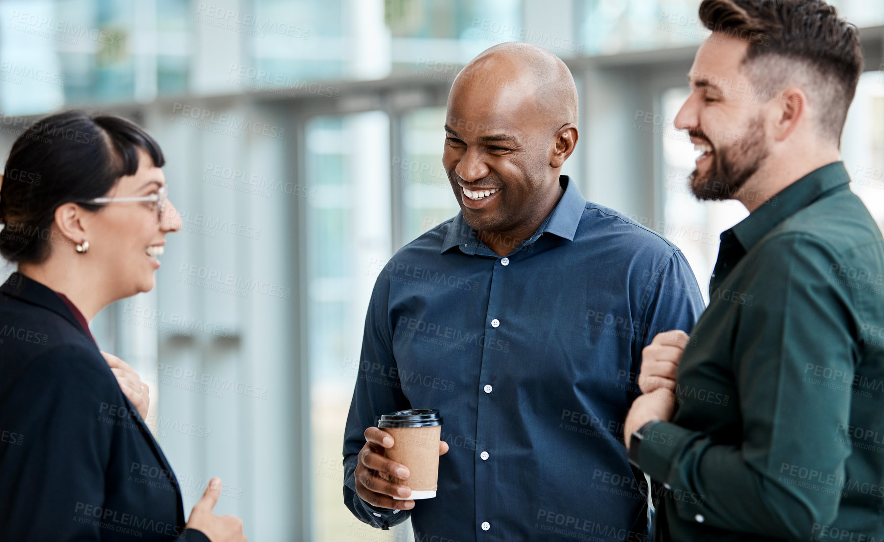 Buy stock photo Cropped shot of three business colleagues talking while standing in their office