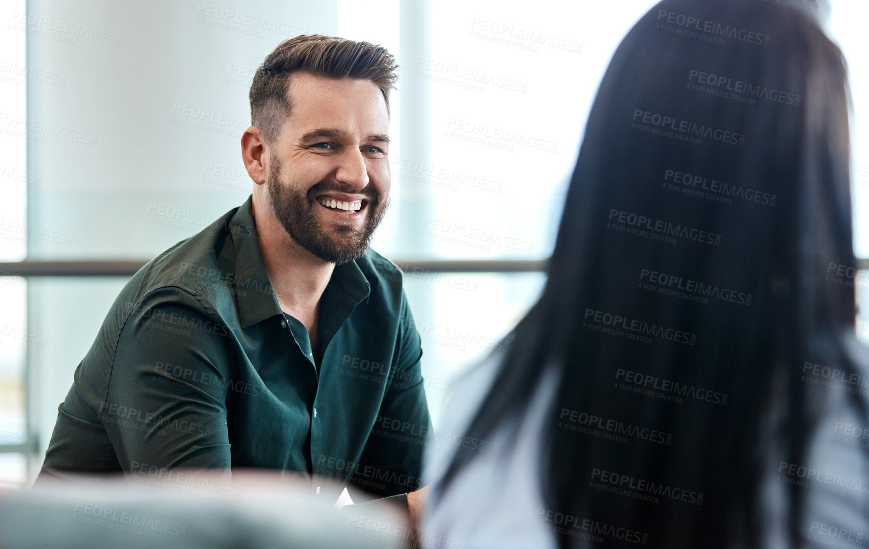 Buy stock photo Cropped shot of two business colleagues sitting down during a meeting in their office