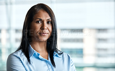 Buy stock photo Cropped portrait of an attractive businesswoman standing in her office