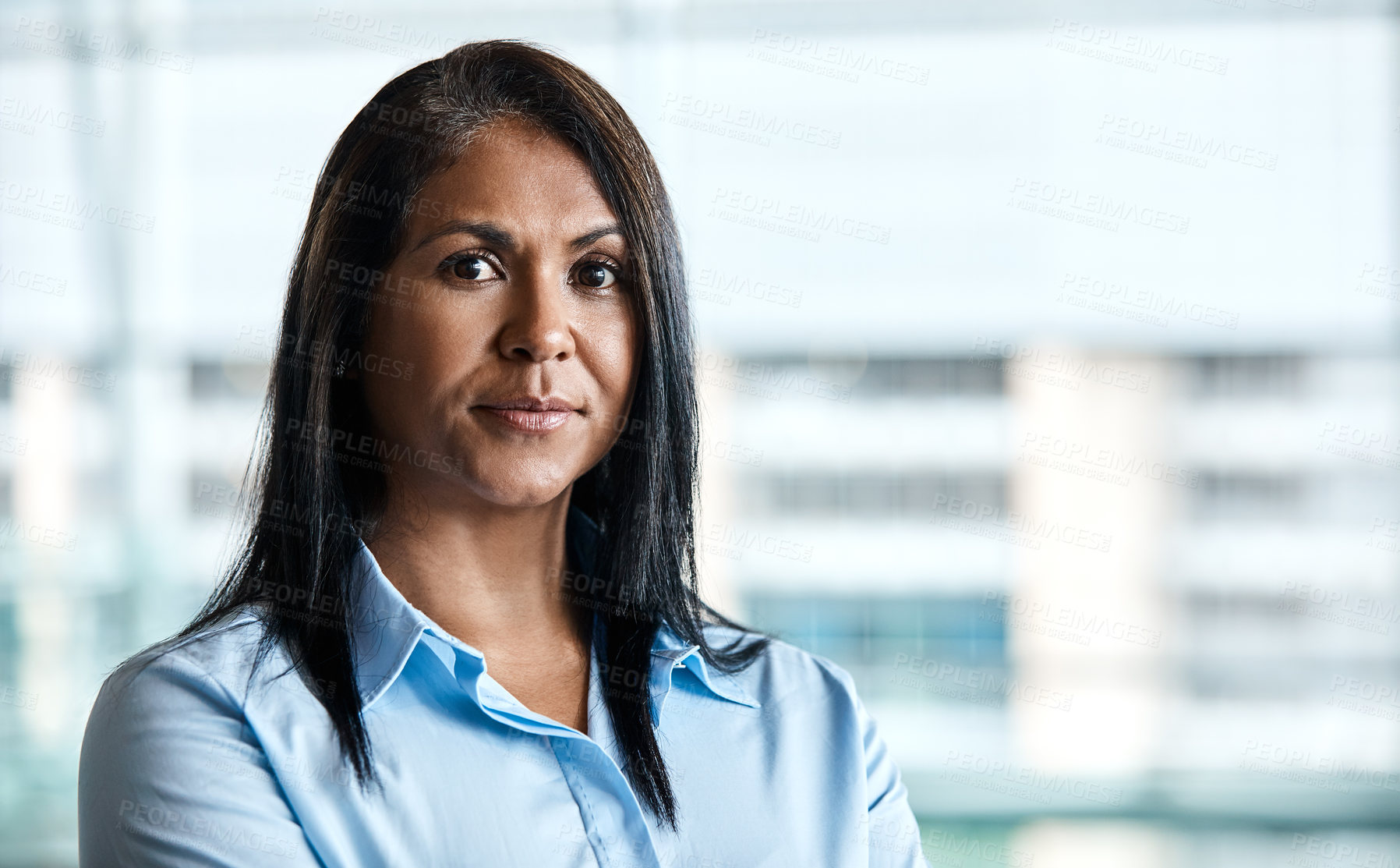 Buy stock photo Cropped portrait of an attractive businesswoman standing in her office
