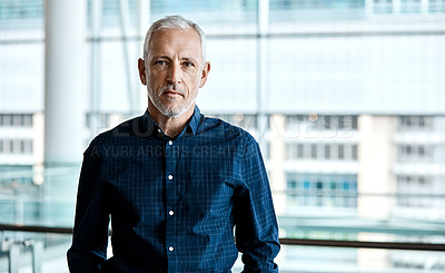 Buy stock photo Cropped portrait of a handsome businessman standing in his office