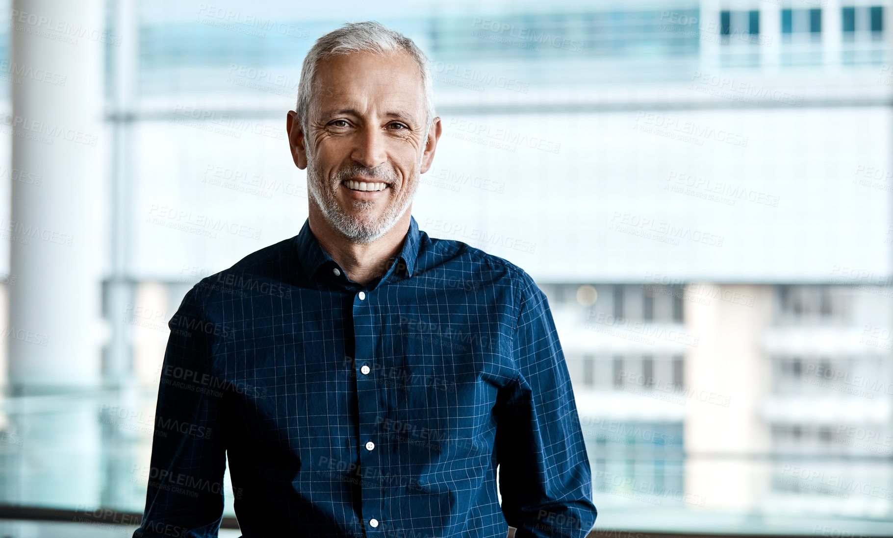 Buy stock photo Cropped portrait of a handsome businessman standing in his office