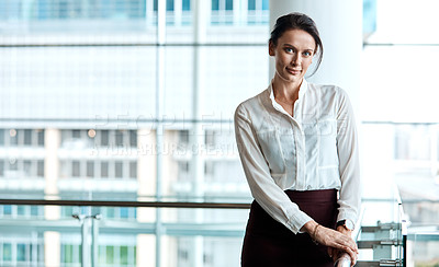 Buy stock photo Cropped portrait of an attractive businesswoman standing in her office