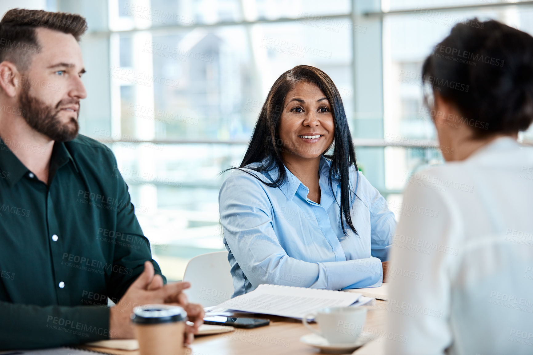 Buy stock photo Meeting, happy woman and listen to team in office for risk management review, discussion or planning. Mature person, smile or work cooperation for insurance policy, strategy or productivity growth