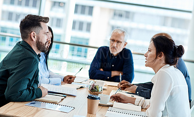 Buy stock photo Shot of a group of businesspeople during a boardroom meeting at work