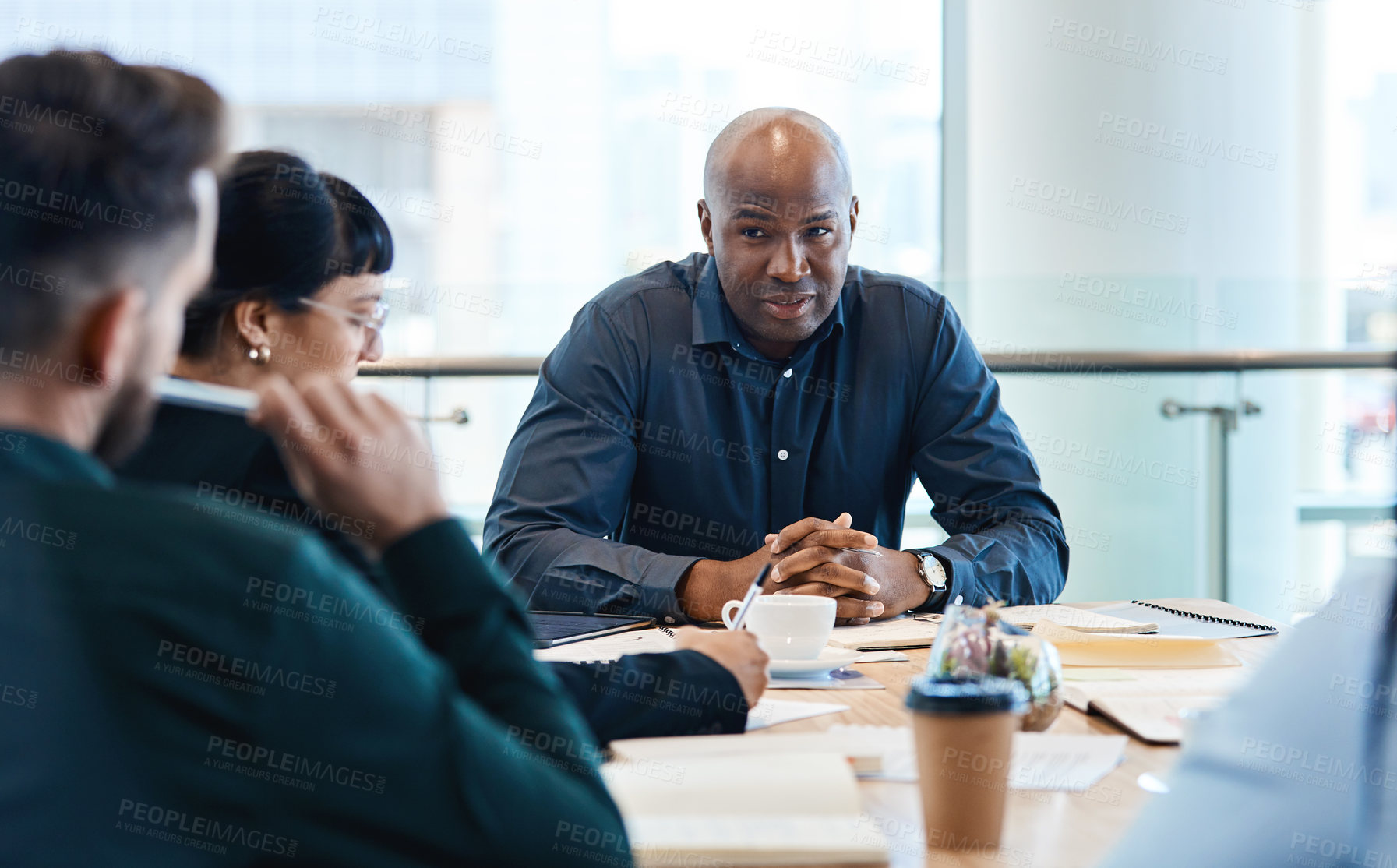Buy stock photo Shot of a group of businesspeople during a boardroom meeting at work