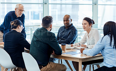 Buy stock photo Shot of a group of businesspeople during a boardroom meeting at work
