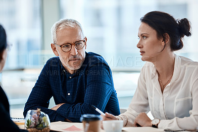 Buy stock photo Shot of a group of businesspeople during a boardroom meeting at work