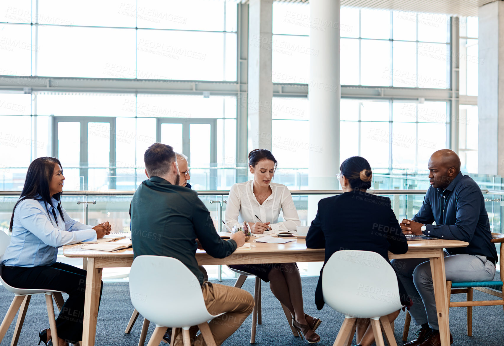 Buy stock photo Meeting, business people and planning in office for solution, discussion or financial notebook. Briefing, proposal and talking with team, investment agenda or project management notes in boardroom