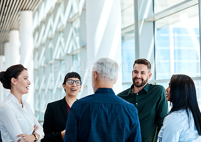 Buy stock photo Shot of a group of businesspeople having a discussion together at work