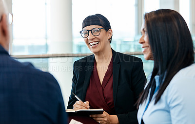 Buy stock photo Shot of a group of businesspeople during a meeting at work