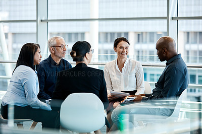 Buy stock photo Shot of a group of businesspeople during a meeting at work