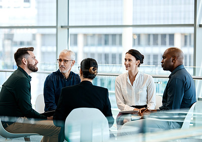 Buy stock photo Shot of a group of businesspeople during a meeting at work