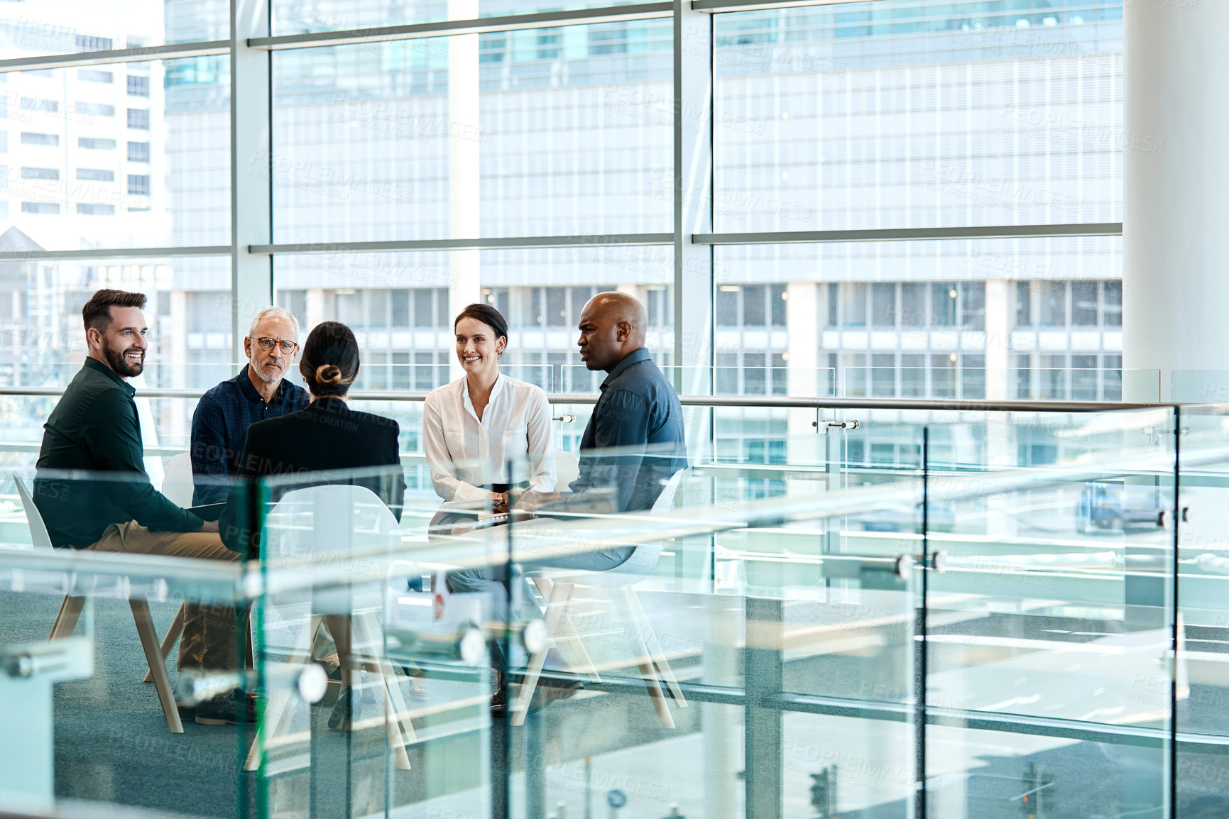 Buy stock photo Full length shot of a group of businesspeople during a meeting at work