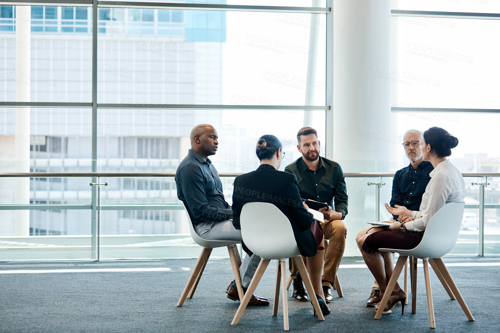 Buy stock photo Full length shot of a group of businesspeople during a meeting at work