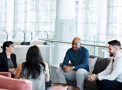 Buy stock photo Shot of a group of businesspeople having a meeting together at work