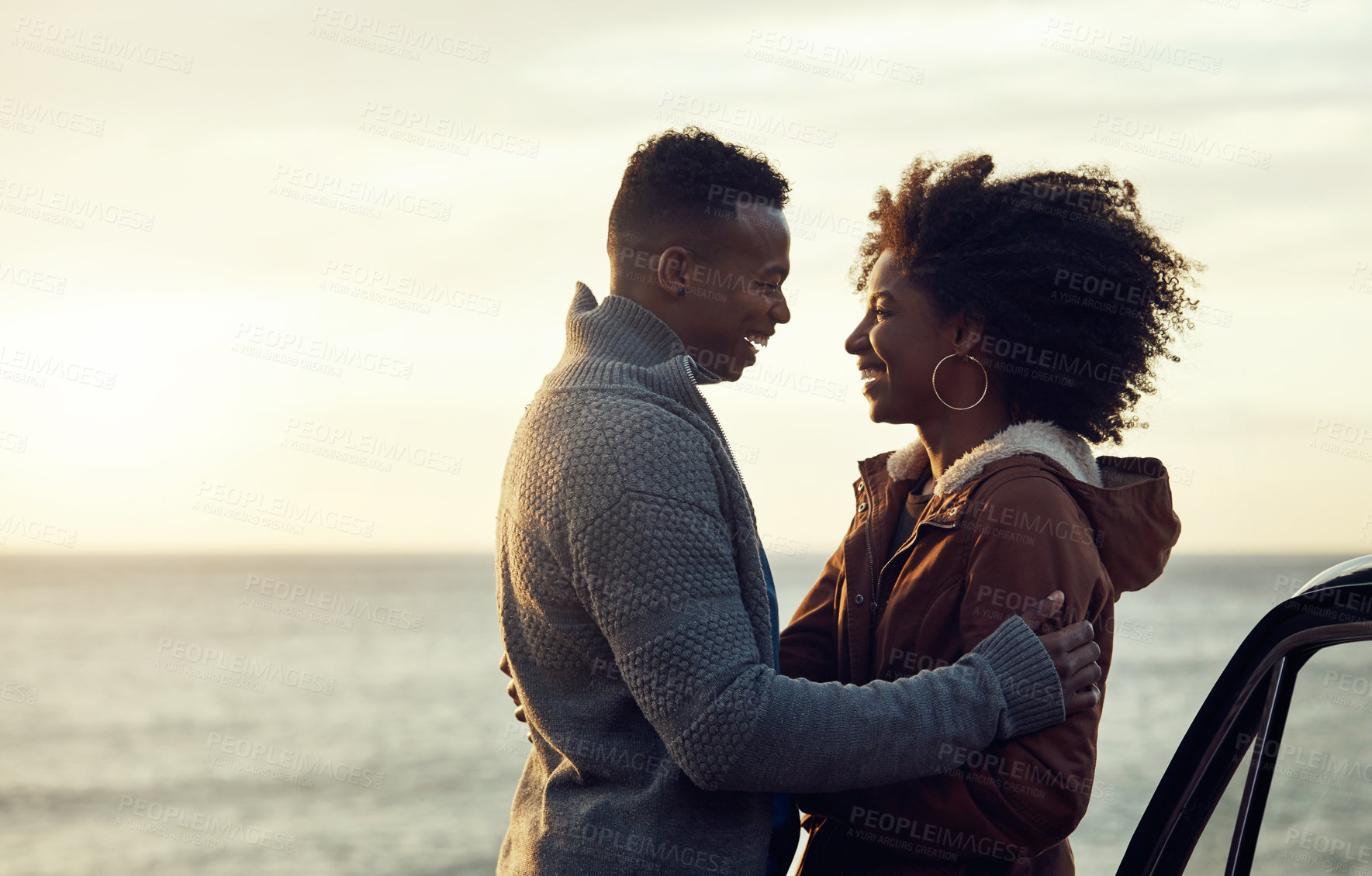 Buy stock photo Smile, couple and car in nature for travel, adventure and bonding together for romantic holiday. Space, people and embrace at seaside with vehicle, partner affection and weekend getaway for vacation