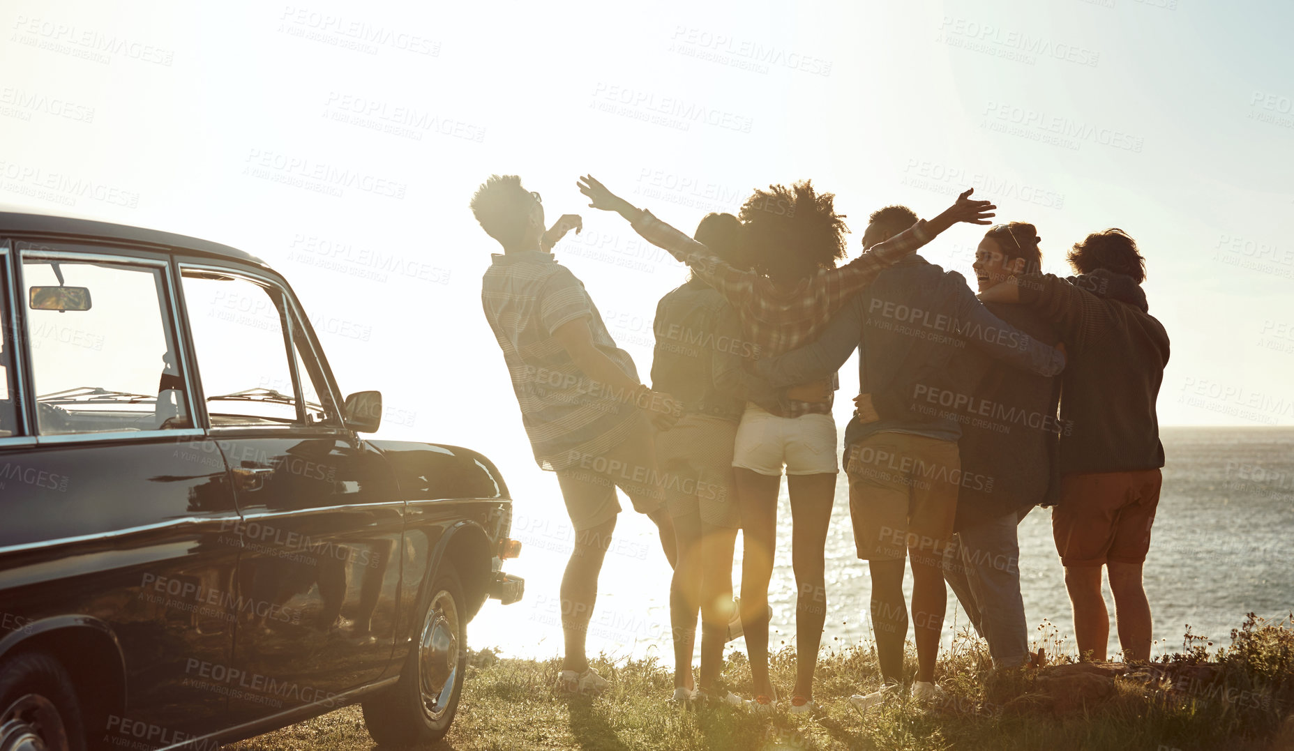 Buy stock photo Back, people and travel at beach for road trip, adventure and celebration of holiday gathering. Smile, friends and freedom at sea with car, socializing and sightseeing for weekend getaway on vacation
