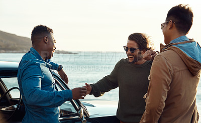 Buy stock photo Cropped shot of a diverse young group of friends socialising together on the beach during a road trip