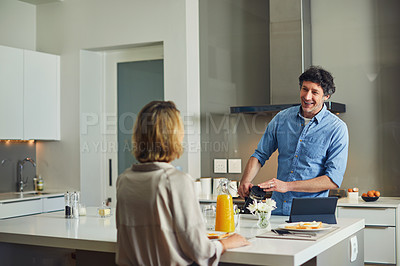 Buy stock photo Shot of a mature couple having breakfast together at home