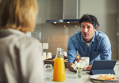 Buy stock photo Shot of a mature couple having breakfast together at home