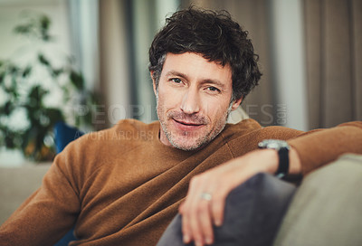 Buy stock photo Portrait of a mature man relaxing on the sofa at home