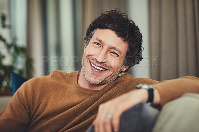 Buy stock photo Portrait of a mature man relaxing on the sofa at home