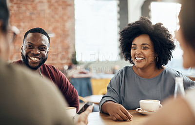 Buy stock photo Cropped shot of a young diverse group of friends sitting together and enjoying coffee in a cafe during the day