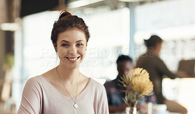 Buy stock photo Cropped shot of an attractive young woman sitting on her own in a cafe during the day