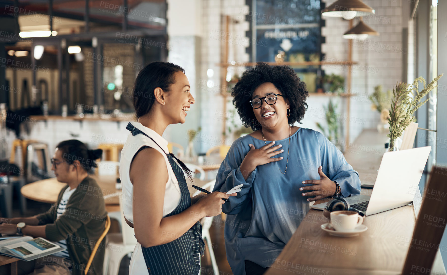 Buy stock photo Happy, waitress and woman at cafe with notepad, customer order and menu options for dining service. Smile, server and freelancer at coffee shop with laptop, food recommendation and special request