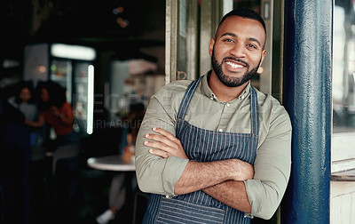Buy stock photo Portrait of a young man standing at the doorway of his cafe