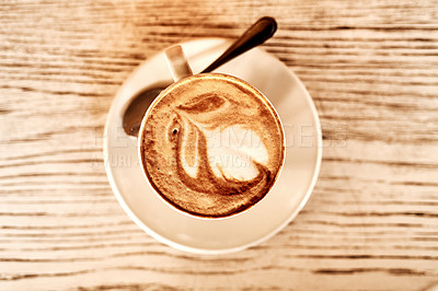 Buy stock photo High angle shot of a cappuccino on a table in a coffee shop