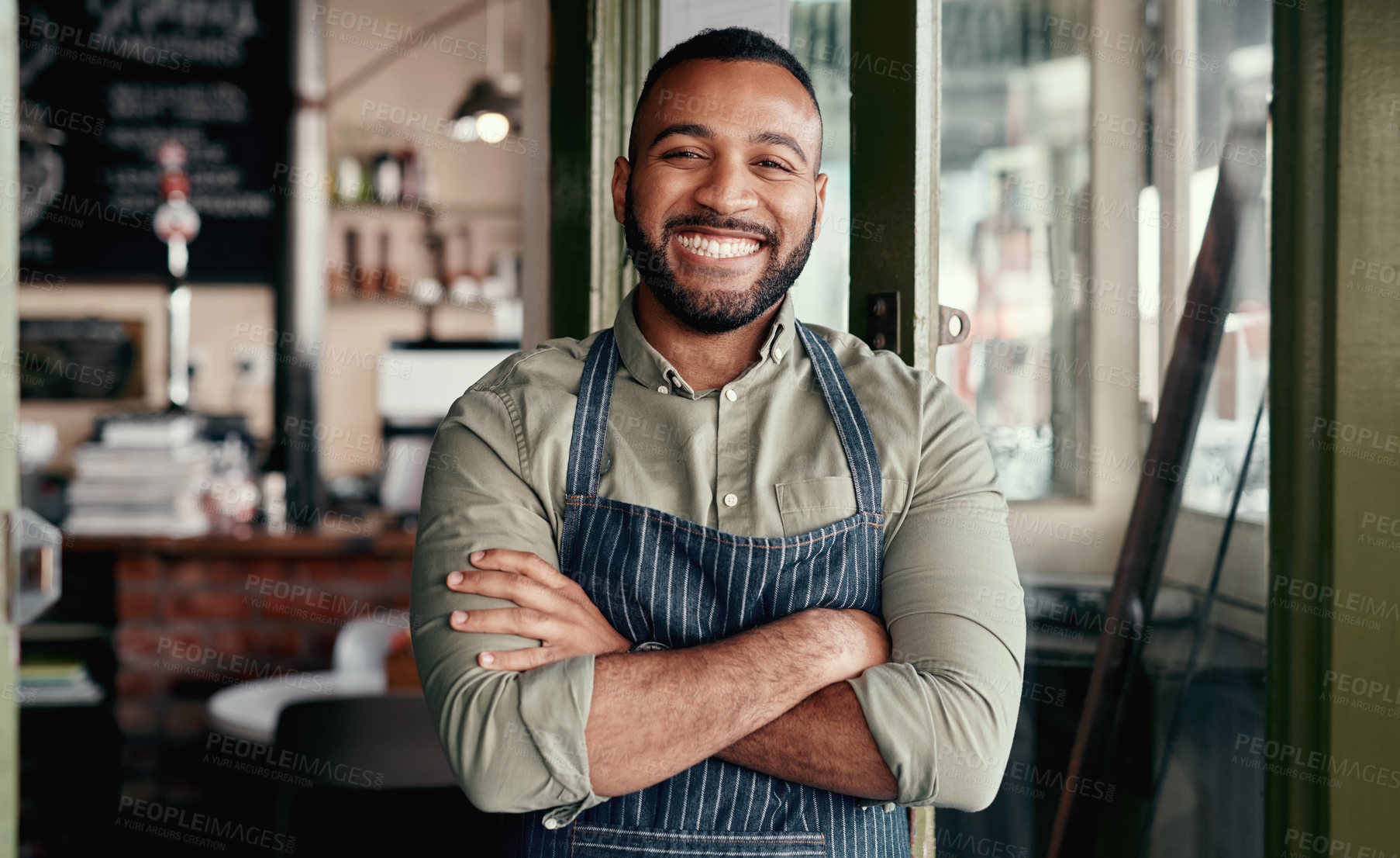 Buy stock photo Portrait of a young man working in a cafe