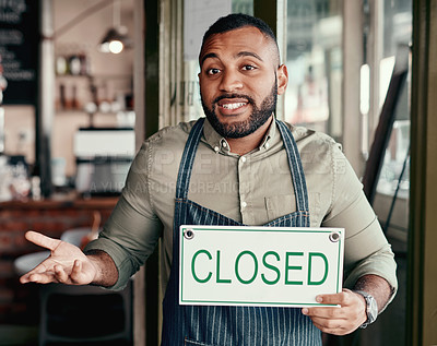 Buy stock photo Portrait of a young man shrugging while holding a 