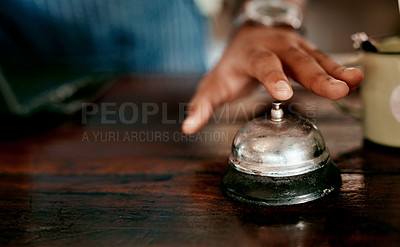 Buy stock photo Closeup shot of an unrecognisable man ringing a service bell in a cafe
