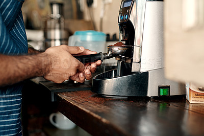 Buy stock photo Closeup shot of a barista preparing coffee in a cafe