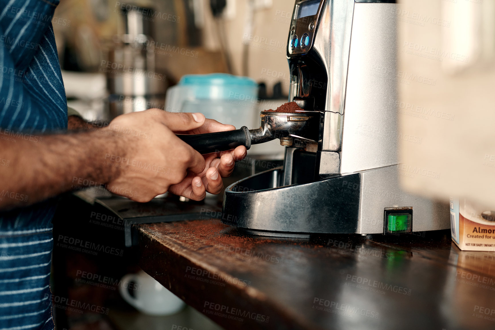 Buy stock photo Closeup shot of a barista preparing coffee in a cafe