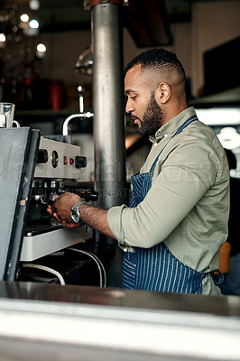 Buy stock photo Shot of a barista preparing coffee in a cafe