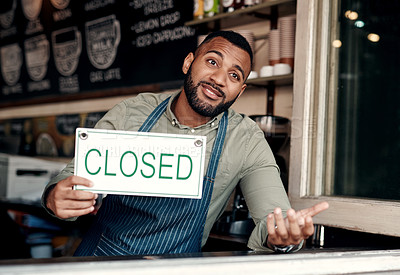 Buy stock photo Shot of a young man shrugging while holding a 
