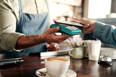 Buy stock photo Closeup shot of a digital payment being made with a cellphone in a cafe