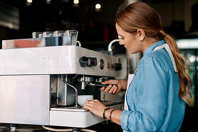 Buy stock photo Shot of a barista preparing coffee in a cafe
