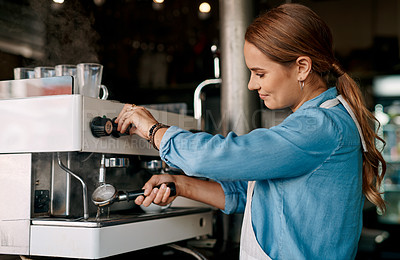 Buy stock photo Shot of a barista preparing coffee in a cafe