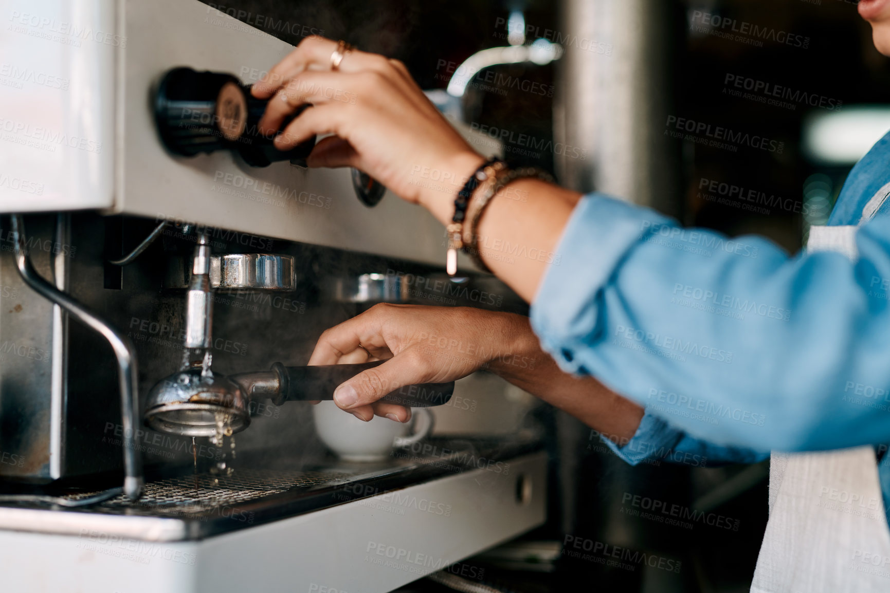 Buy stock photo Closeup shot of a barista preparing coffee in a cafe