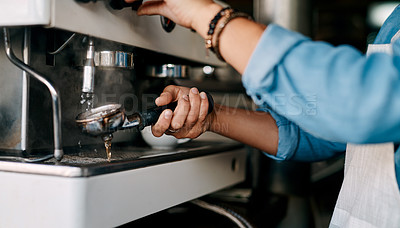 Buy stock photo Closeup shot of a barista preparing coffee in a cafe
