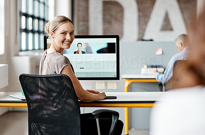 Buy stock photo Shot of an attractive young businesswoman sitting at her desk in the office